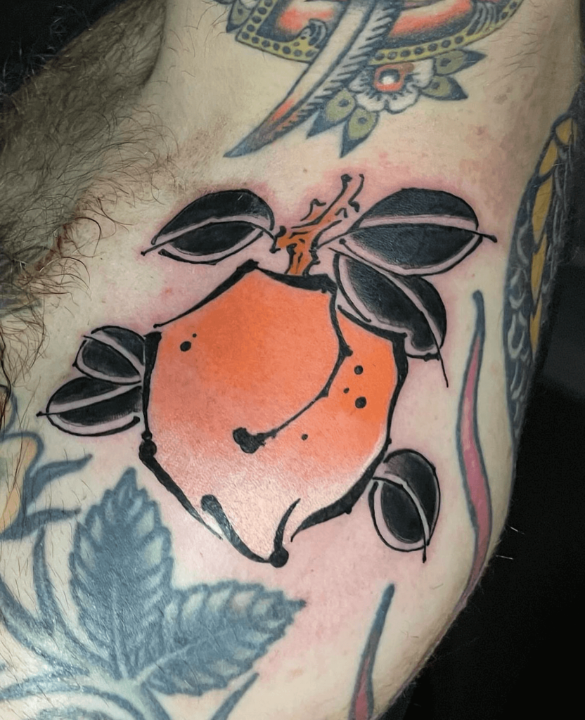 Painted Peach Tattoo with visible paintstroke effect in black and orange by Joao Tereso