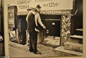 Men looking at old traditional tattoo studio in Copenhagen, Denmark